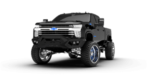 A white jeep parked on a large rock in an outdoor setting, showcasing its rugged tires and off-road capabilities.