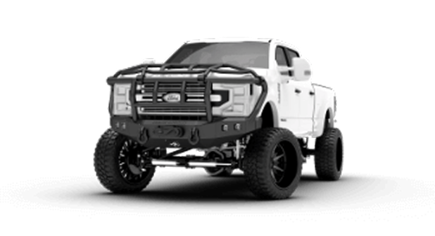 A white jeep parked on a large rock in an outdoor setting, showcasing its rugged tires and off-road capabilities.