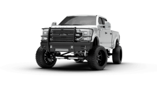 A white jeep parked on a large rock in an outdoor setting, showcasing its rugged tires and off-road capabilities.